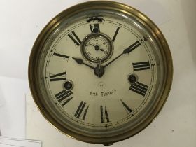 An American brass cased wall clock possible a ship