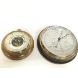 A silvered dial round wall barometer and an anroid