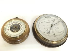 A silvered dial round wall barometer and an anroid