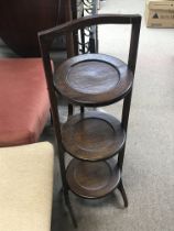 An oak three tier cake stand , 85cm tall