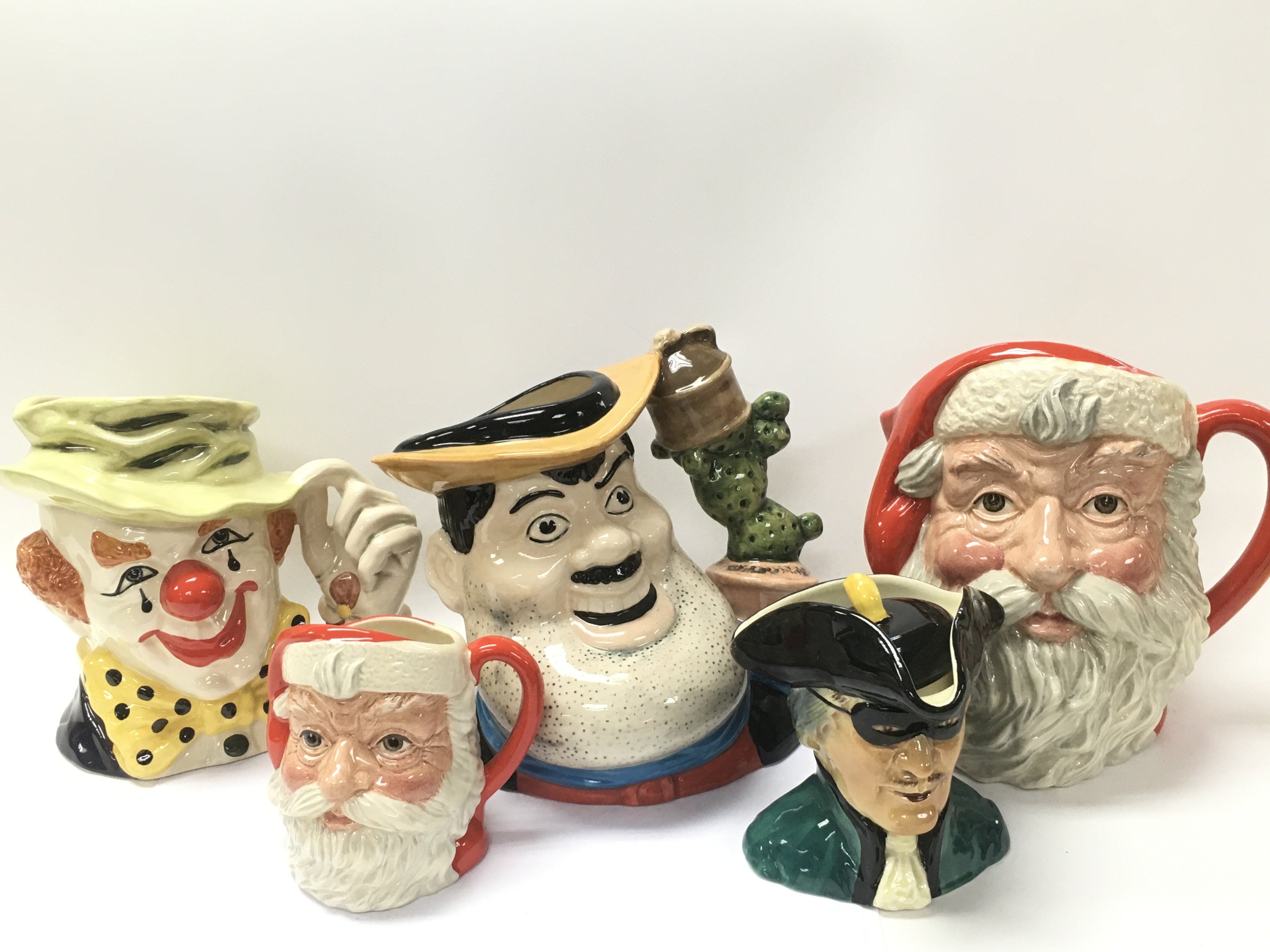 A collection of Royal Doulton character jugs inclu