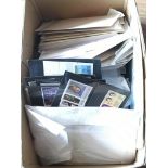 A box containing a quantity of stamps unused and u