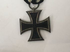 A Genuine I World War iron cross 2nd Class with attached full length ribbon.