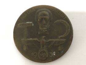 A 1934 German labour day badge, postage category a