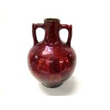 A Pilkingtons red lustre pottery vase, some damage