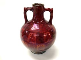 A Pilkingtons red lustre pottery vase, some damage