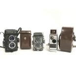 Vintage cameras including a Yashica Mat-124 G, Yas