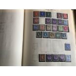 A collection of seven albums of mixed world stamps