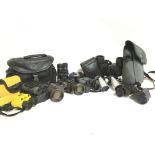 A collection of binoculars including Pentax, Proto