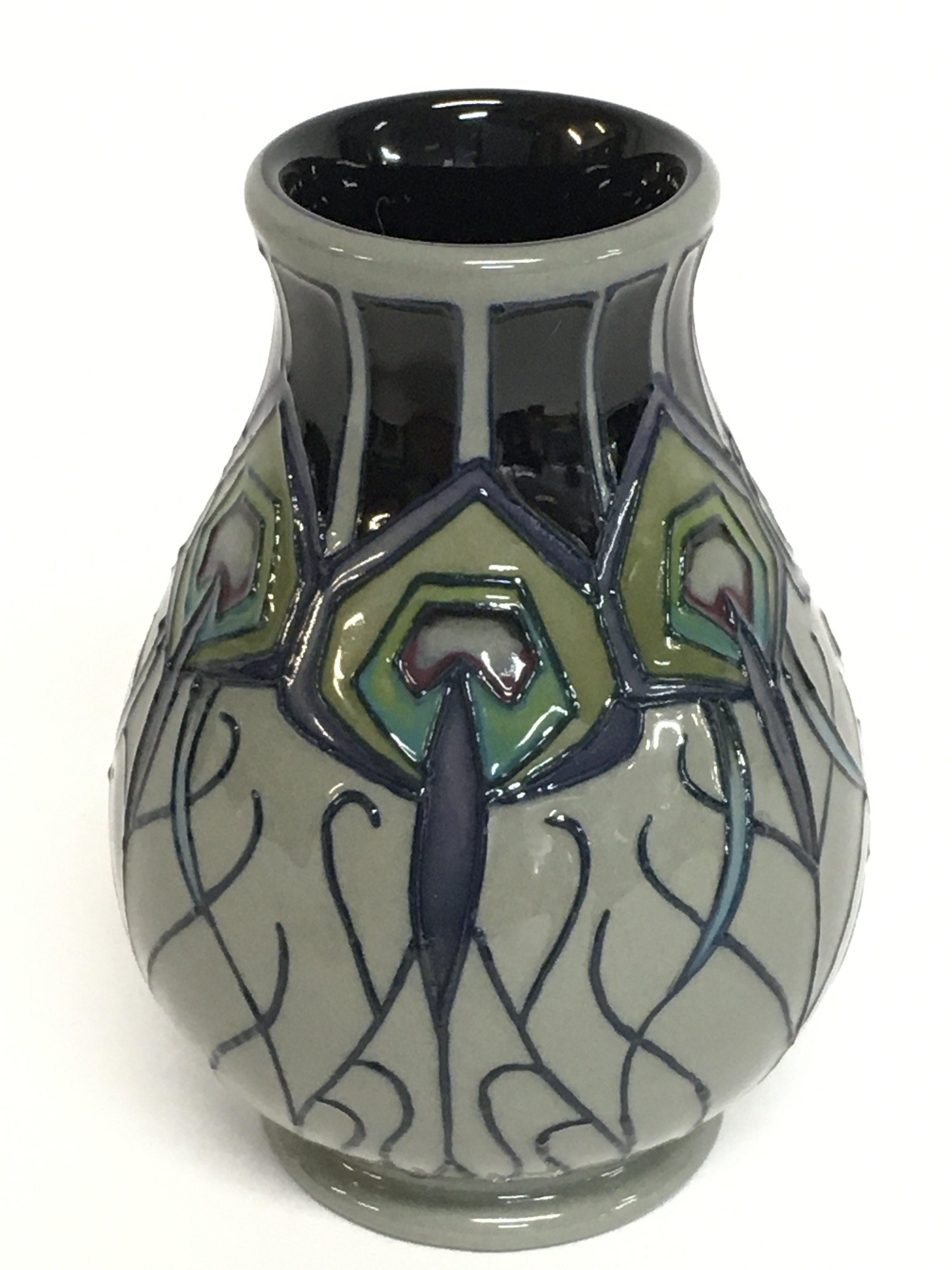 A Moorcroft vase, 10cm tall. No obvious damage or