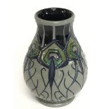 A Moorcroft vase, 10cm tall. No obvious damage or