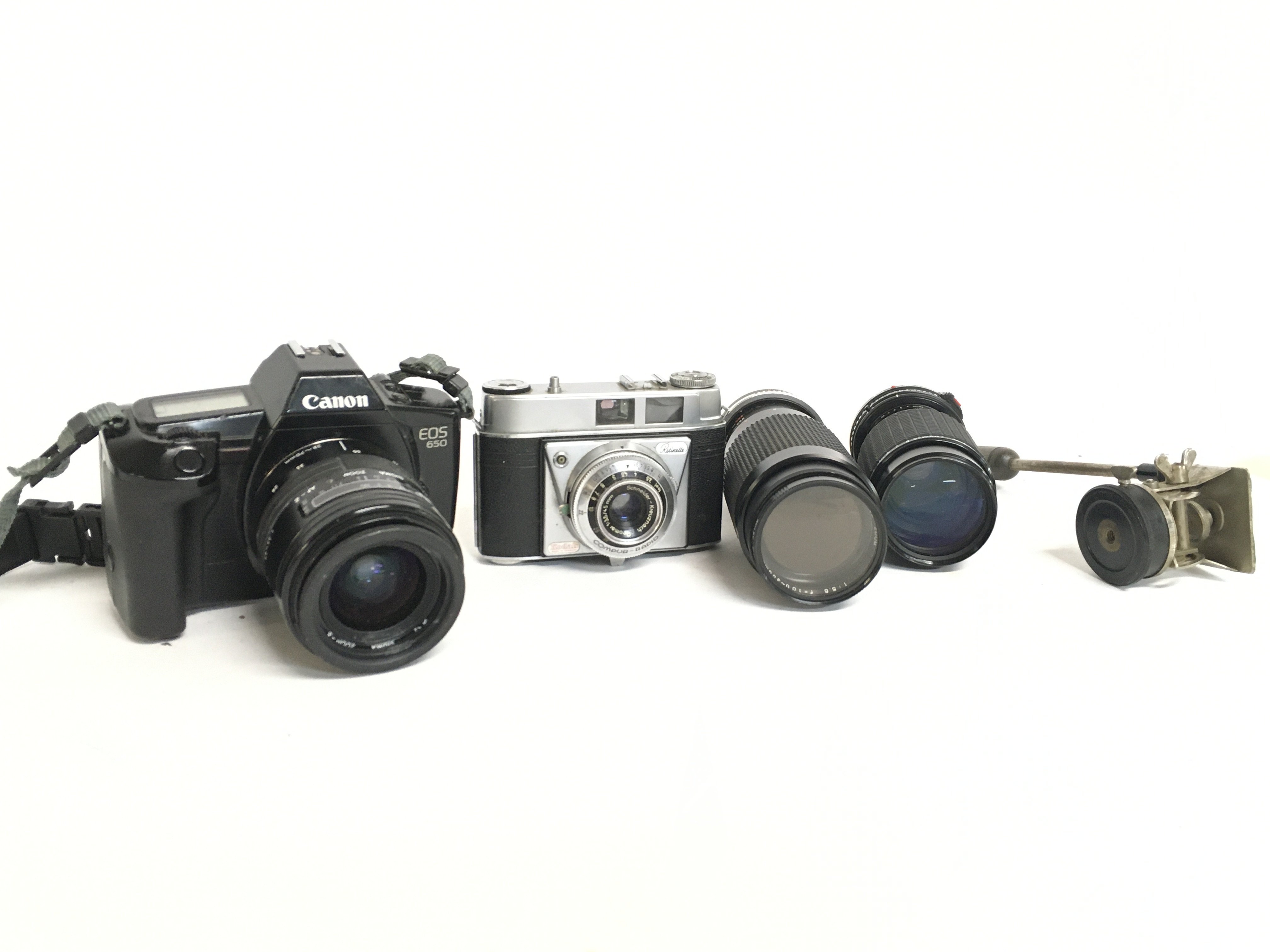 A collection of vintage cameras including a Canon