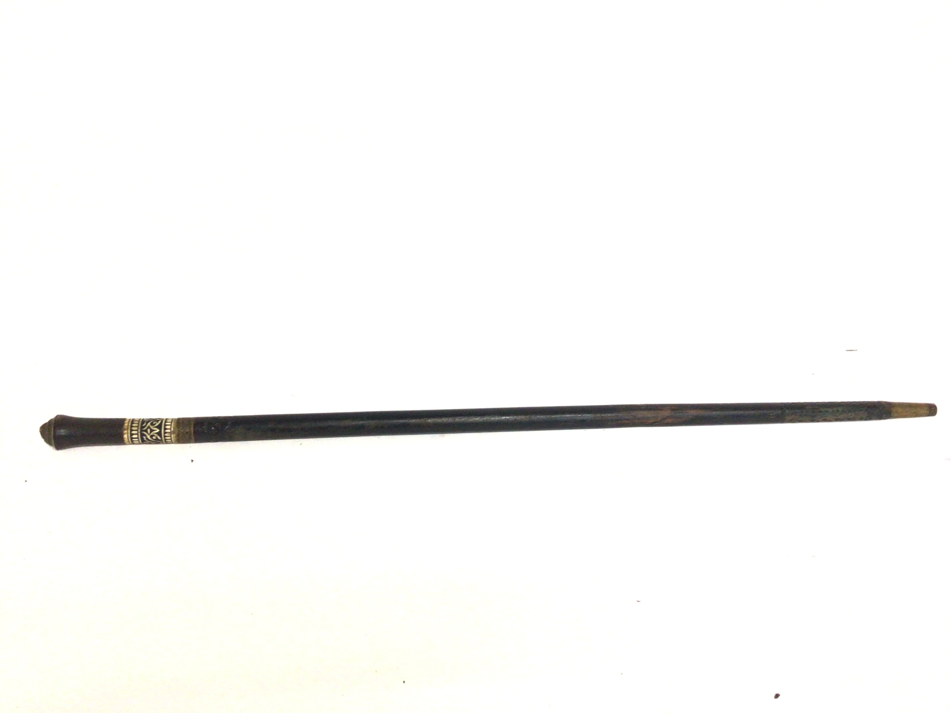A vintage ebonised Indian sword stick with carved