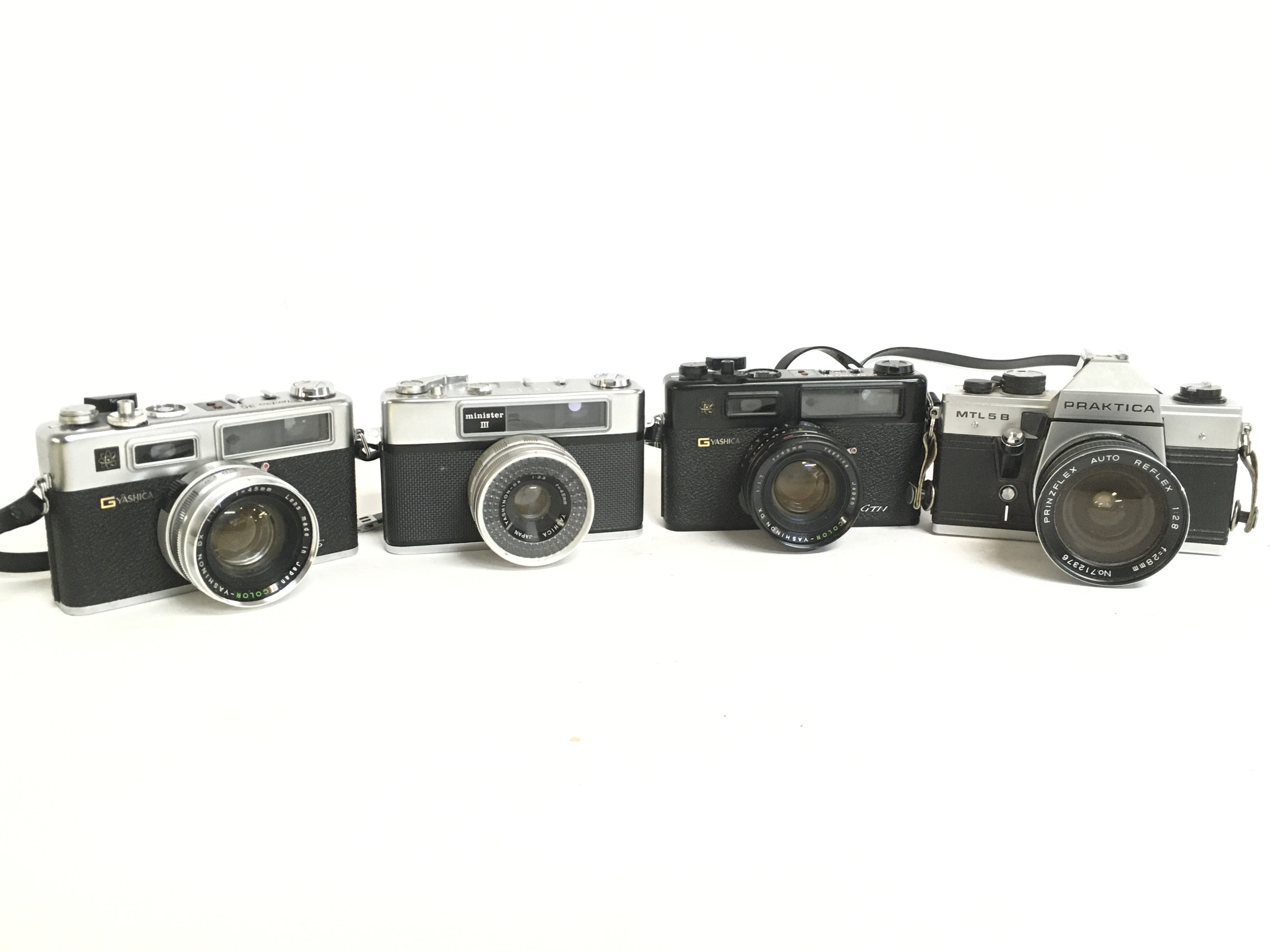 Vintage cameras including a Minister III, Praktica