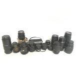 A collection of camera lenses including a Yashica