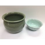 A celadon ware fish bowl, approx diameter 27cm and