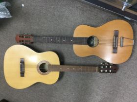 Four acoustic guitars. Shipping category D.