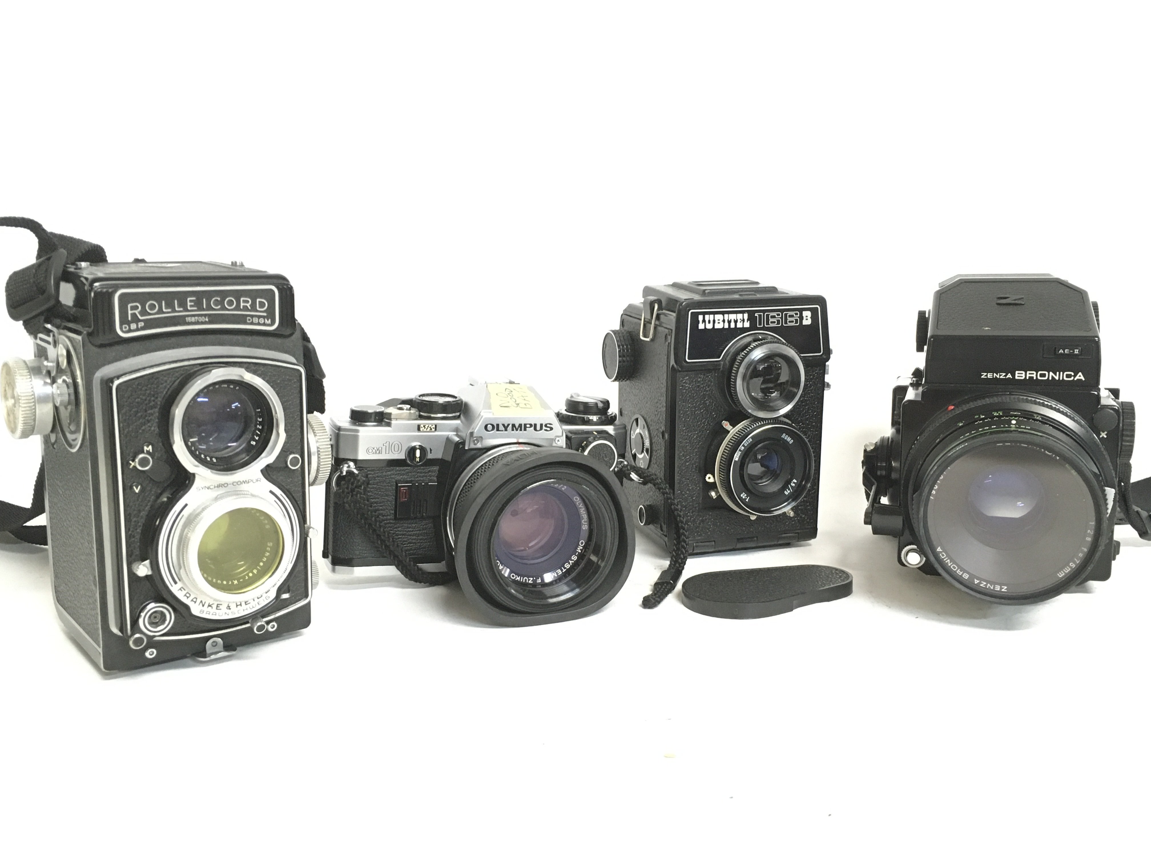 Vintage cameras including a Rolleicord, Olympus OM