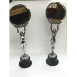 A pair of Art Deco style figural mirrors of nude m