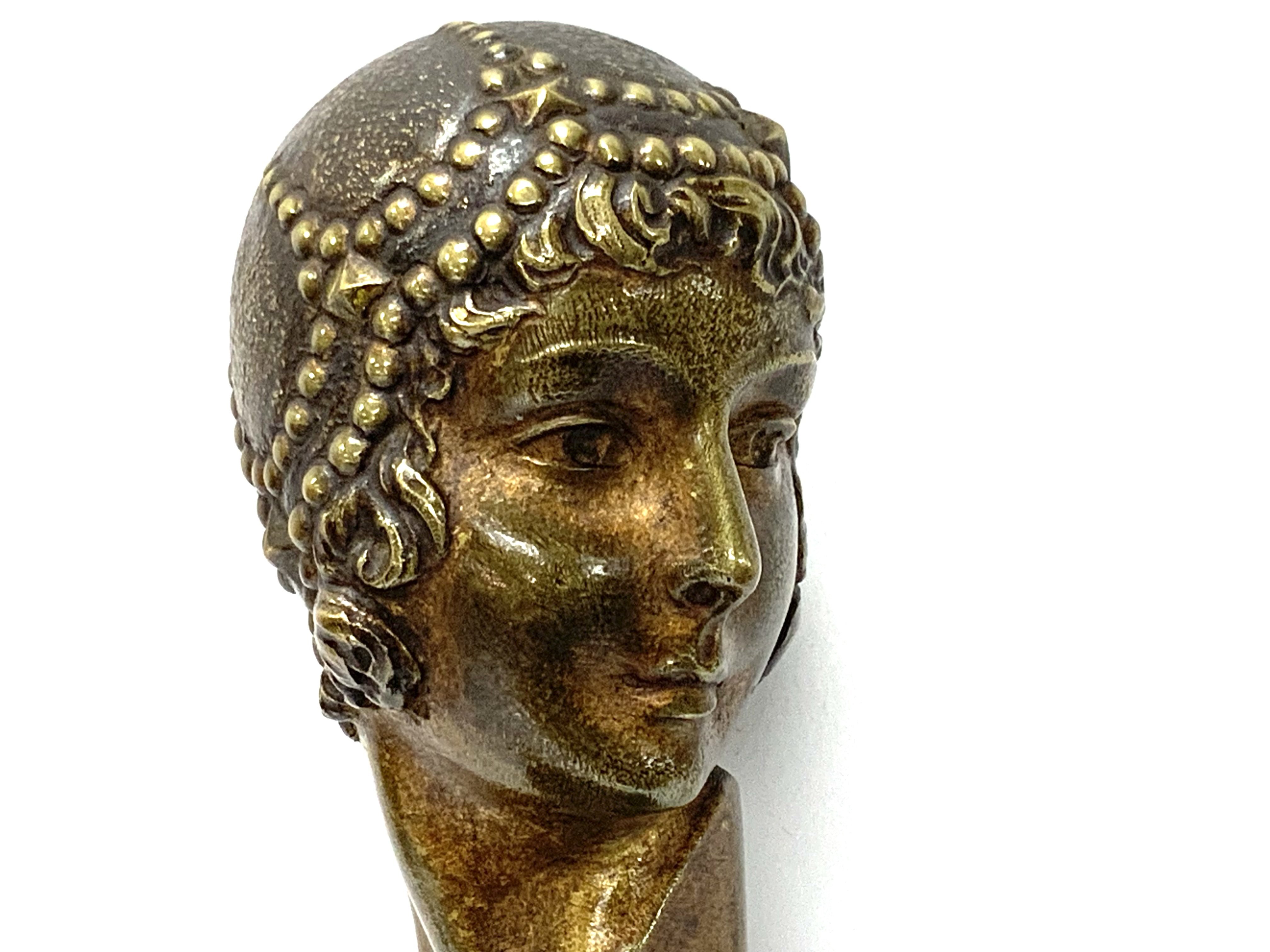 A Small Art Nouveau bronze bust of a lady signed C