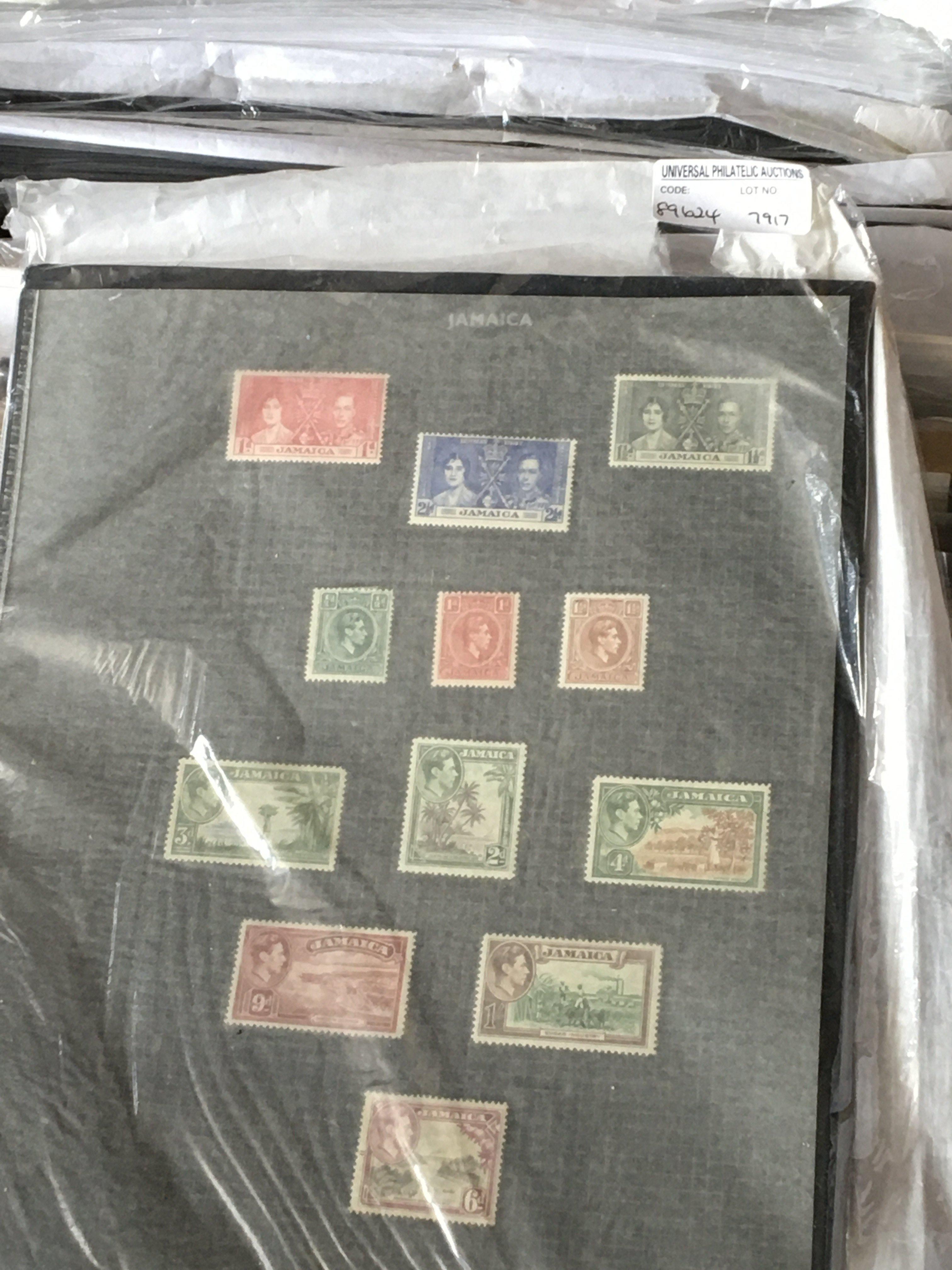 A box containing a large quantity of world stamp w