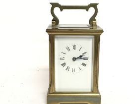 A brass carriage clock, this lot cannot be posted