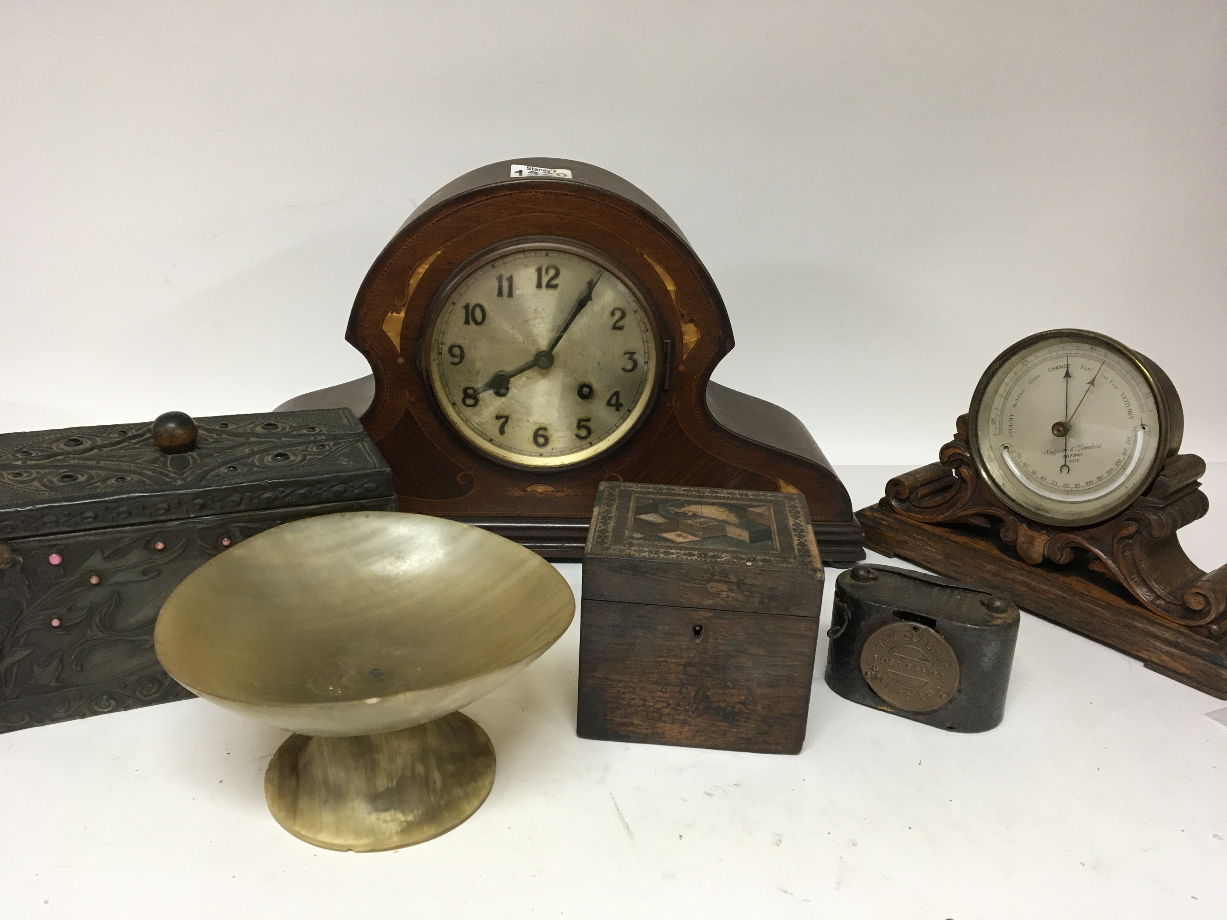 A late Victorian barometer on a carved oak stand a