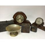 A late Victorian barometer on a carved oak stand a