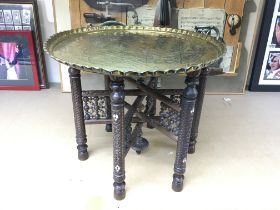 A Persian bobbin table. Approx 42cm high and 49cm