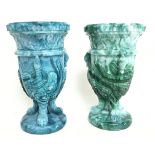 A pair of malachite slag Gryphon glass urns, 17cm