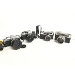 Vintage cameras including an Olympus Om30, Om10, Y