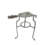 A Victorian large brass and iron trivet. 36cm tall