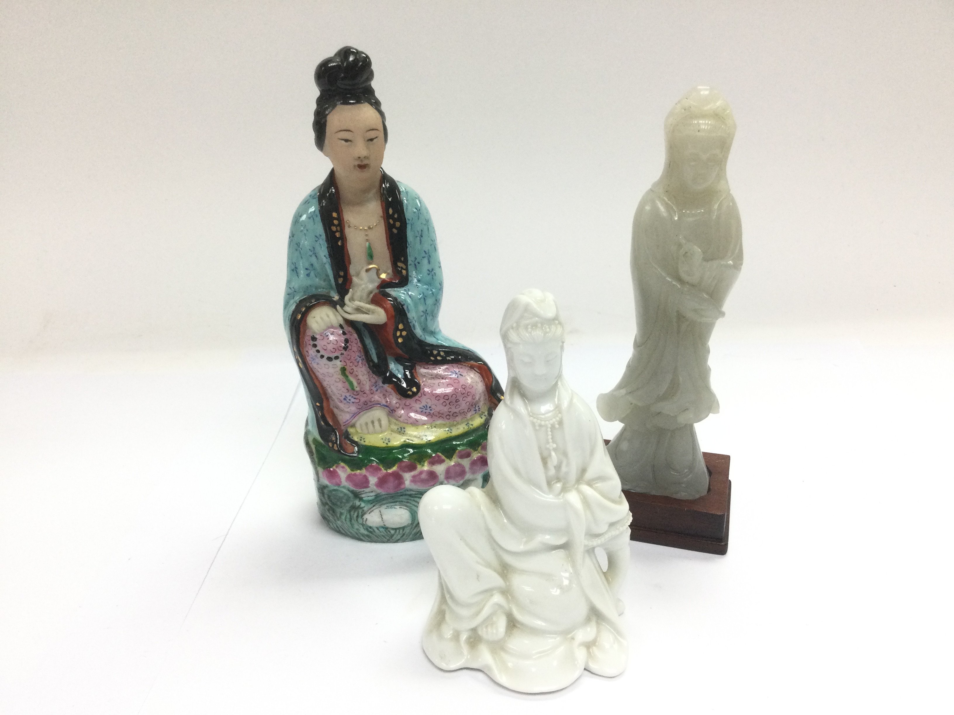 Three Oriental figures of geishas, tallest approx
