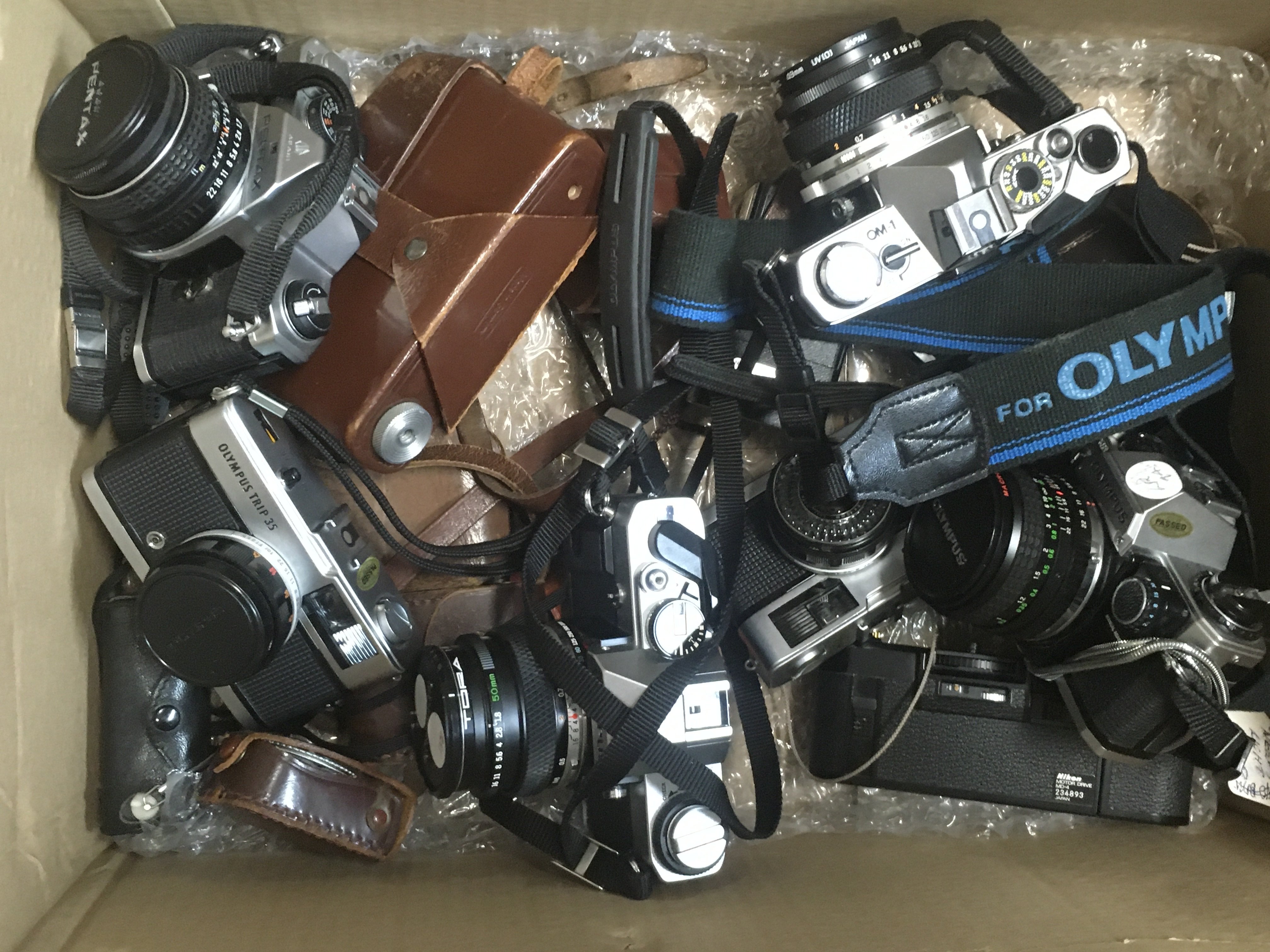 A collection of Vintage cameras and accessories including Olympus and ...