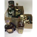 Two boxes of alcohol including various whiskies. S