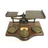 A set of brass office beam balance scales with a s