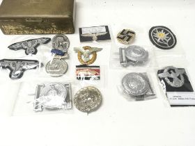 A tin containing German Third Reich badges metal a