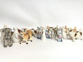 A large Collection of various Jersey pottery cows,