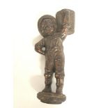 A vintage cast iron bar top cigar lighter of a boy