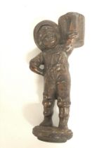 A vintage cast iron bar top cigar lighter of a boy