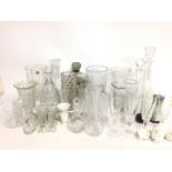 A collection of cut glass including decanters, dri