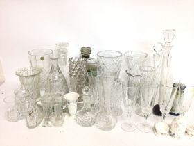 A collection of cut glass including decanters, dri