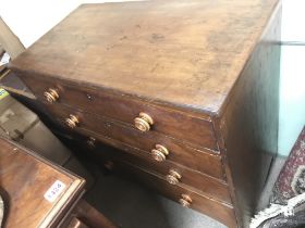 An oak Victorian chest of drawers with splayed leg