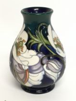 A Moorcroft trial vase, 14cm tall. No obvious dama