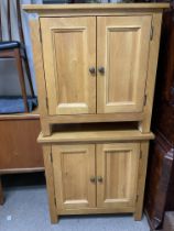 A pair of modern oak 2 door bedside cabinets, 70cm