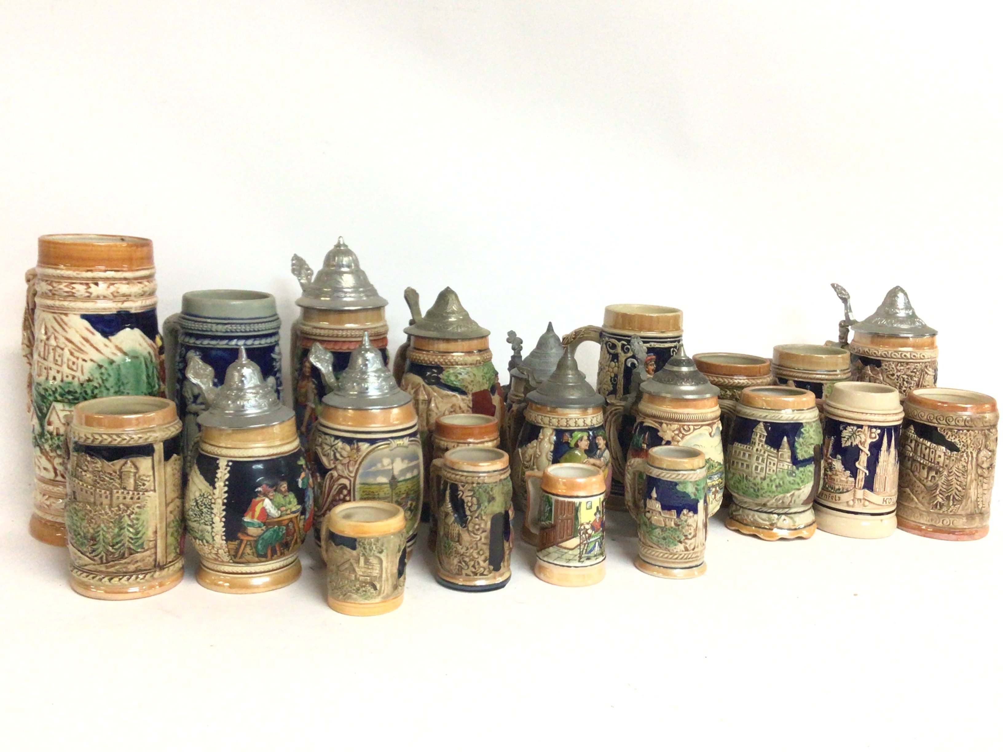 A large collection of German Stein jugs and tankar