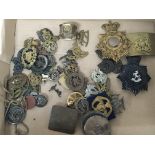 A collection of military badges belt buckles shako