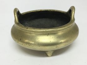 A 19th century Chinese brass open censer with rais