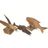 A collection of carved hardwood fish ornaments inc