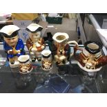 A collection of porcelain character jugs including